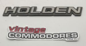 VL CALAIS FRONT BUMPER UPPER MOULDING BADGE GM 92027578